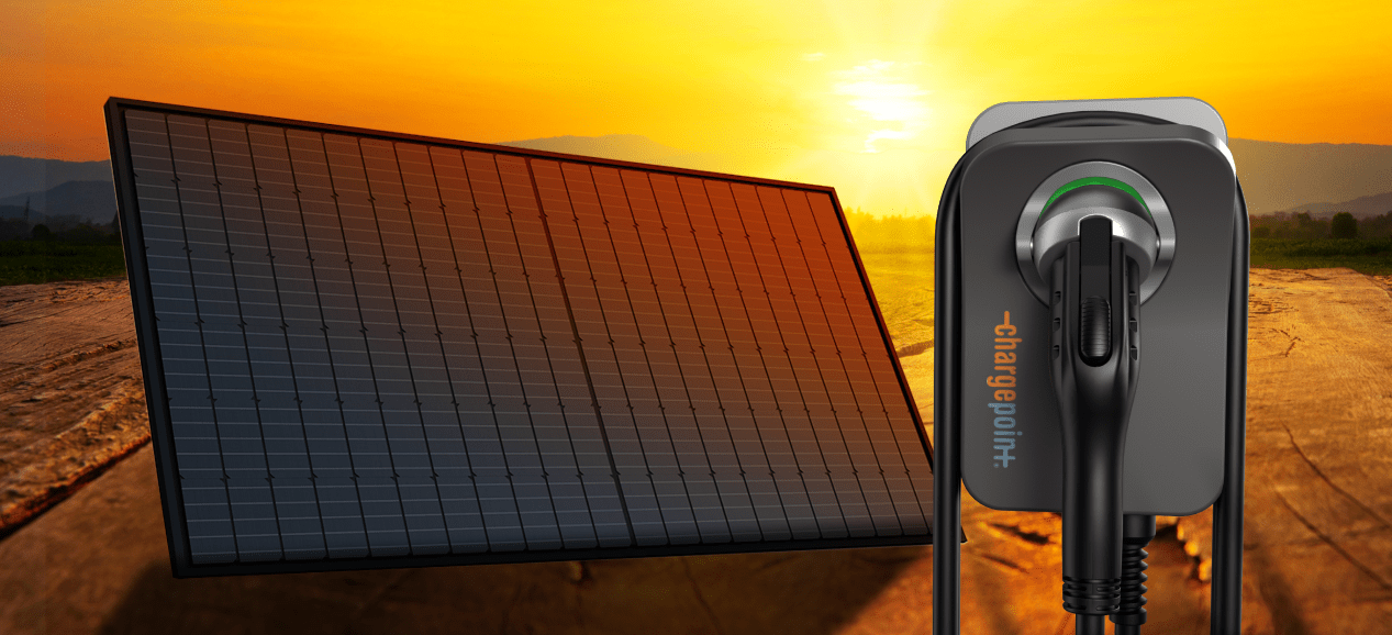 a solar panel in front of a sunset