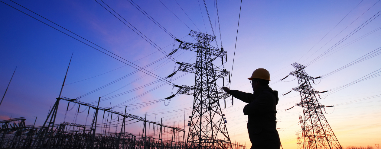 A utility lineman overlooking a power line